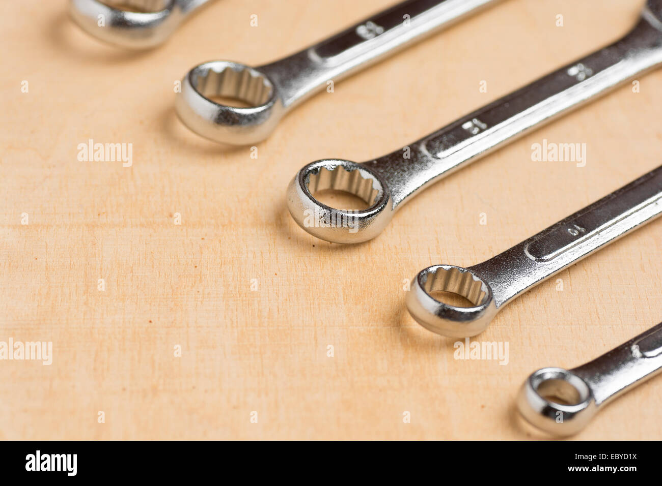 Set of tools on a wood panel Stock Photo - Alamy
