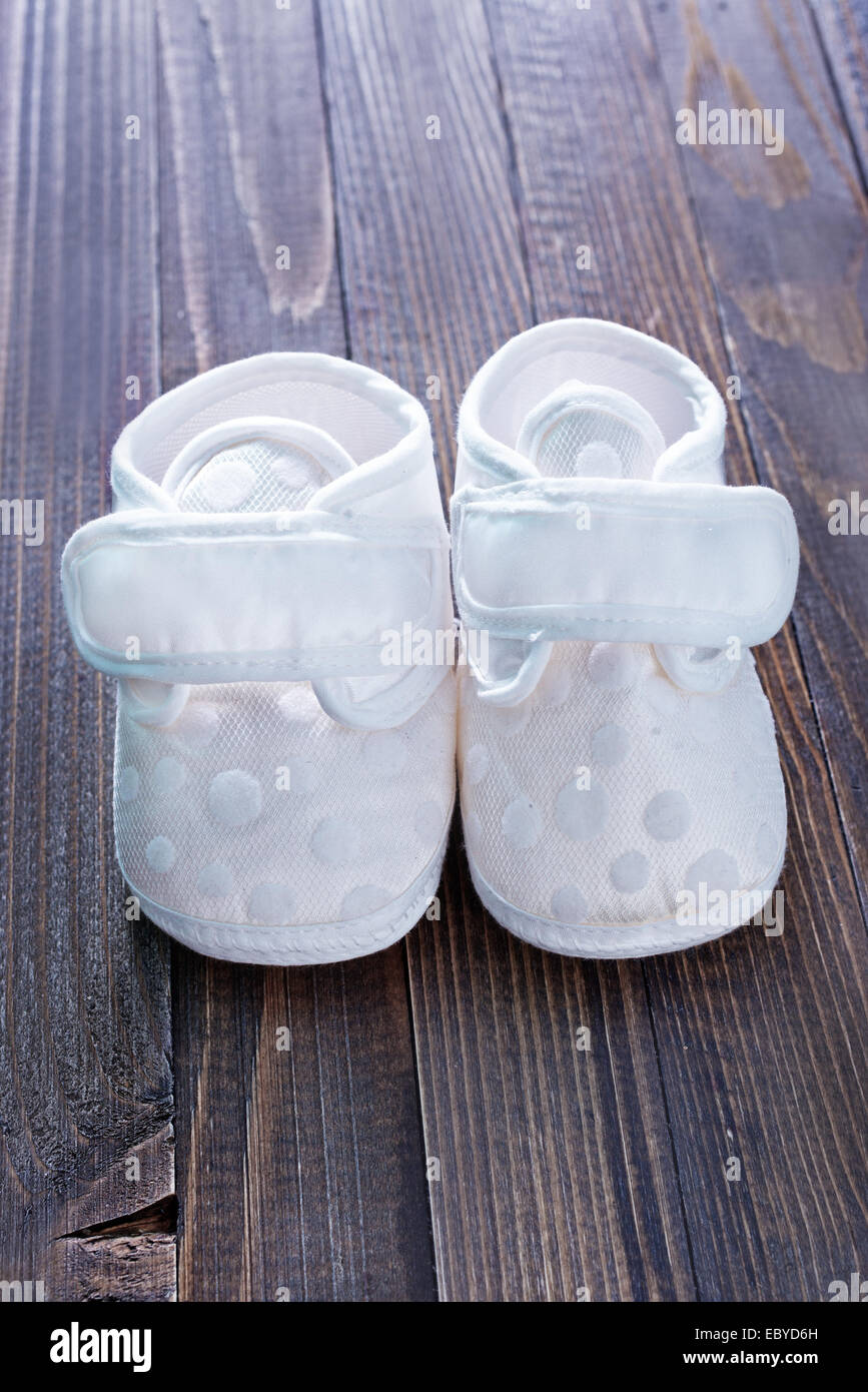 Blue baby shoes on a white fabric Stock Photo - Alamy