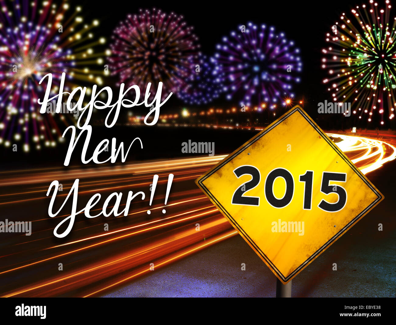 Happy New Year 2015 fireworks and city cars highway lights with yellow road sign. Greeting card design background. Stock Photo