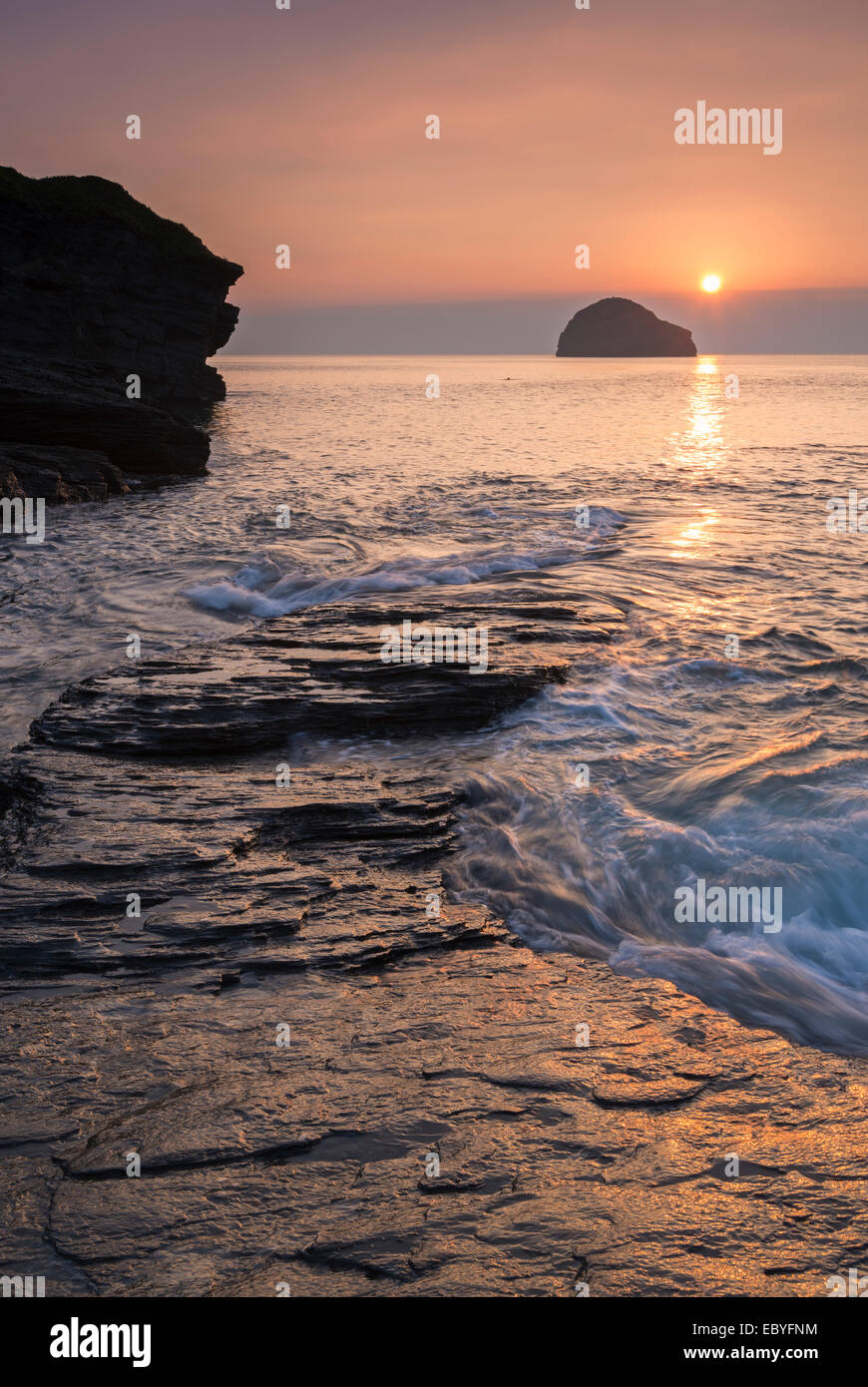 Sunset over Trebarwith Strand beach in North Cornwall, England. Autumn (September) 2014. Stock Photo