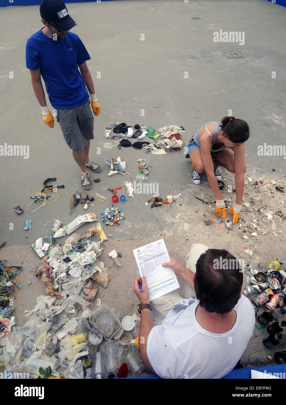 Sorting and tallying a diversity of trash cleaned from North Cottesloe beach by volunteers in one morning. Perth, Western Austra Stock Photo