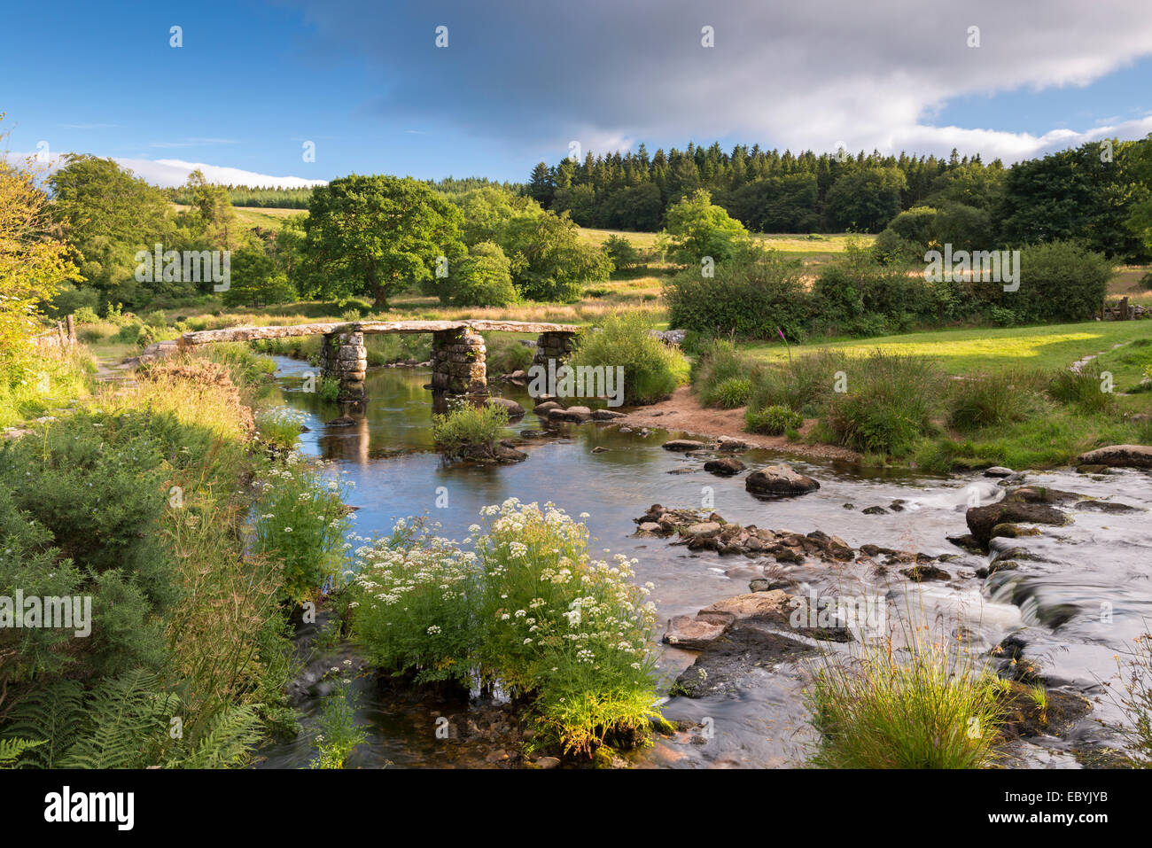 Ancient clapper bridge at Postbridge, Dartmoor National Park, Devon, England. Summer (July) 2014. Stock Photo