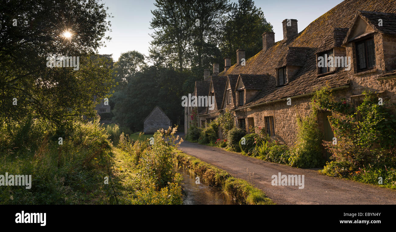 Pretty cottages at Arlington Row in the Cotswolds village of Bibury, Gloucestershire, England. Summer (July) 2014. Stock Photo