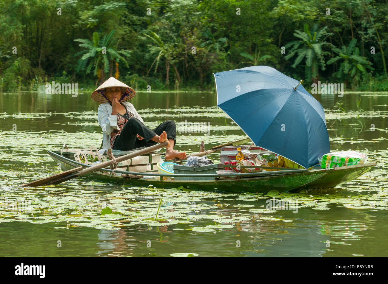 Boat Hawker on River Boi, Tam Coc, Vietnam Stock Photo
