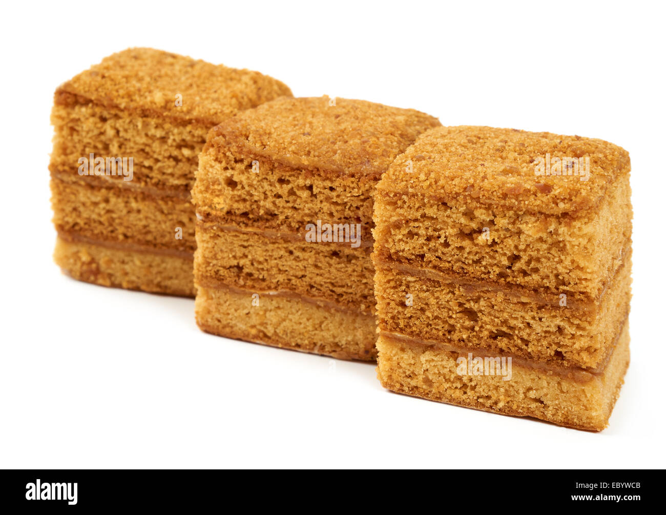 Three pieces of honey cake isolated on white Stock Photo