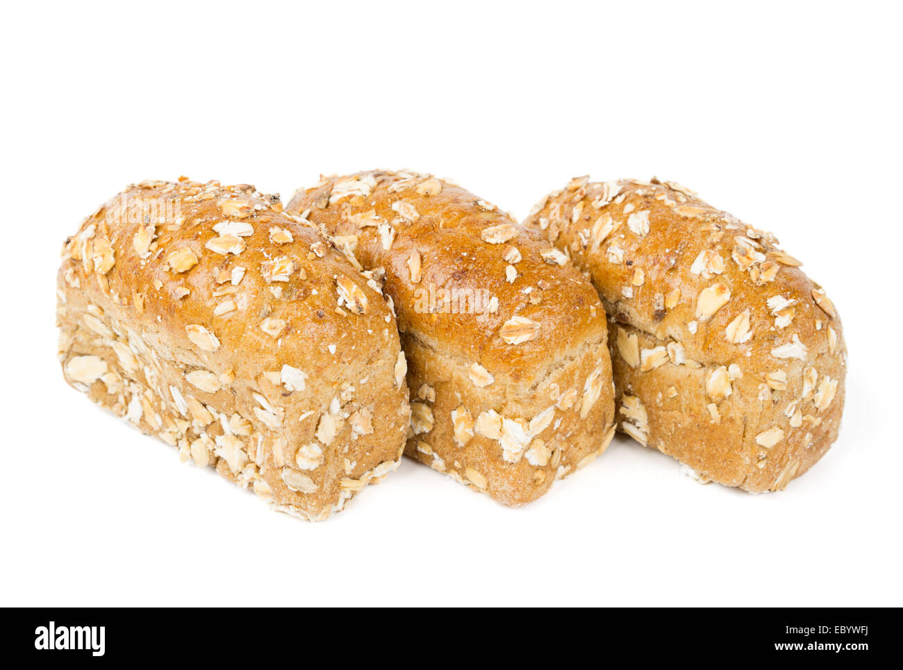 Three buns with oats isolated on white Stock Photo