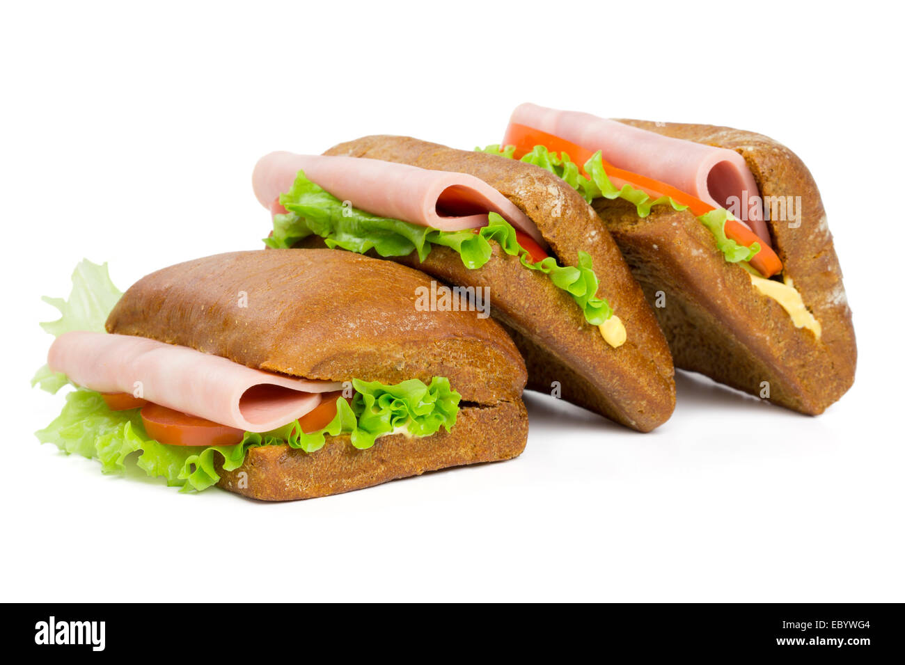 Three sandwiches with ham isolated on white Stock Photo
