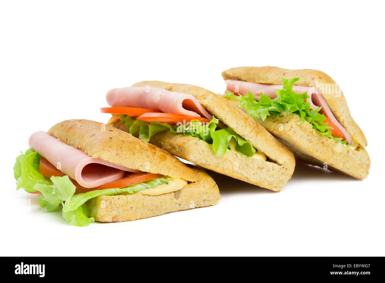 Three sandwiches with slice of ham isolated on white Stock Photo