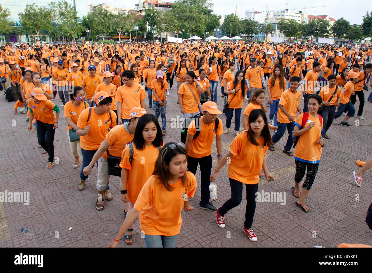 Phnom Penh, Cambodia. 6th Dec, 2014. Young people dance in Phnom Penh, Cambodia, Dec. 6, 2014. Approximately 1,500 young Cambodians on Saturday performed the 'Madison', a popular dance during Khmer wedding receptions and New Year celebrations, in Phnom Penh in order to call for an end of violence against women and girls, an organizer said. Credit:  Sovannara/Xinhua/Alamy Live News Stock Photo