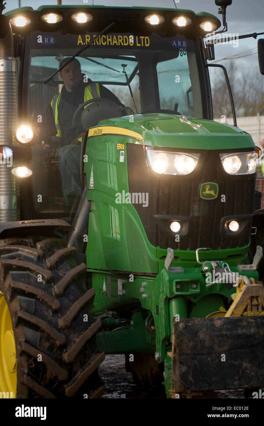 big green tractor tractors john Deere lights at farm farming in the