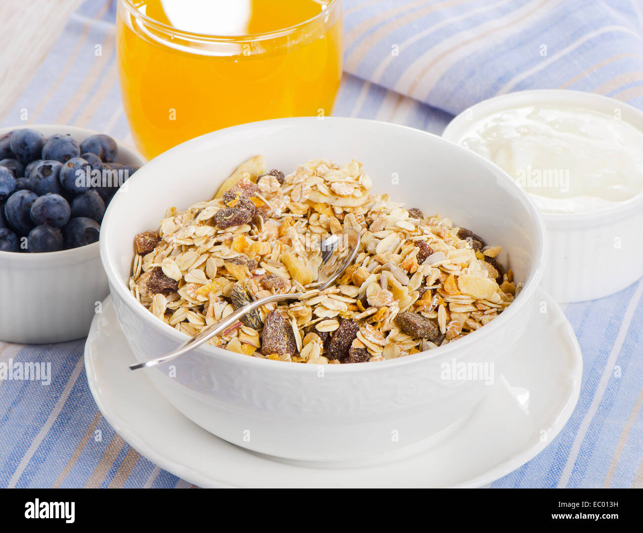 Healthy breakfast muesli , yogurt and juice . Selective focus Stock