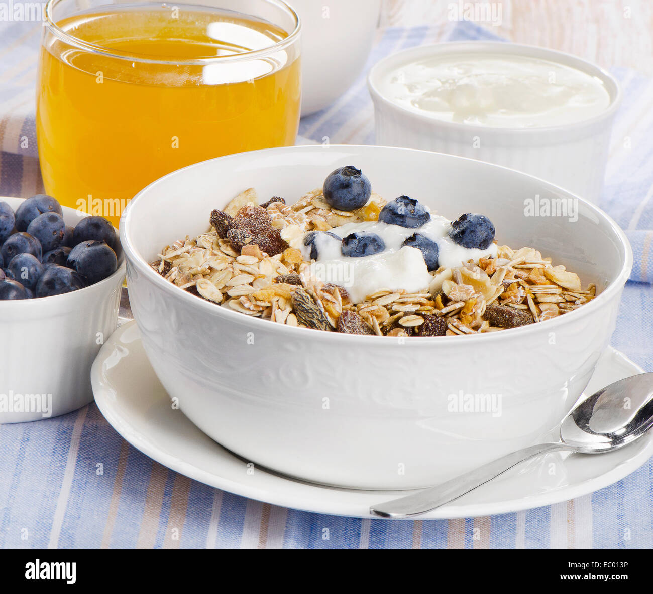 Healthy breakfast muesli , yogurt and juice . Selective focus Stock