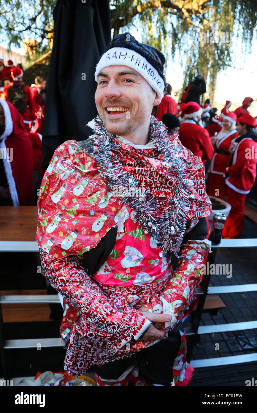 London, UK. 6th December 2014. Participants dressed as Father Christmas in the 2014 London Santacon in the streets of Camden, London which celebrates its 20th anniversdary this year Credit:  Paul Brown/Alamy Live News Stock Photo
