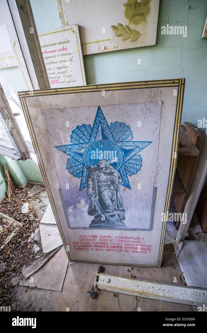 Soviet poster in Middle School Number 3 in Pripyat abandoned city, Chernobyl Exclusion Zone, Ukraine Stock Photo