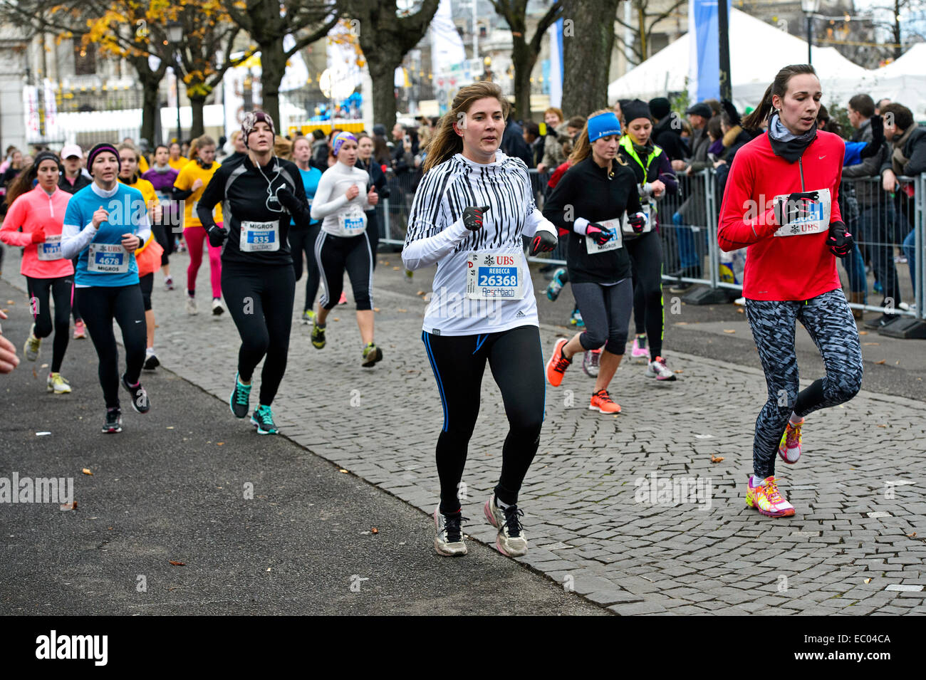 Geneva, Switzerland. 06th Dec, 2014. A new record with more than 36 000 starters was set at this year's 37th edition of the road run Course de l'Escalade, Geneva's biggest annual sporting event. The run is held each December in the narrow lanes of the old town as part of Geneva's Escalade festivities, celebrating the defeat of the surprise attack by the troops of the Duke of Savoy in 1602. The event attracts elite and recreational runners, but also a large crowd of enthusiastic youth and children. For the first time, half of the participants were female in 2014. © GFC Collection/Alamy Live New Stock Photo