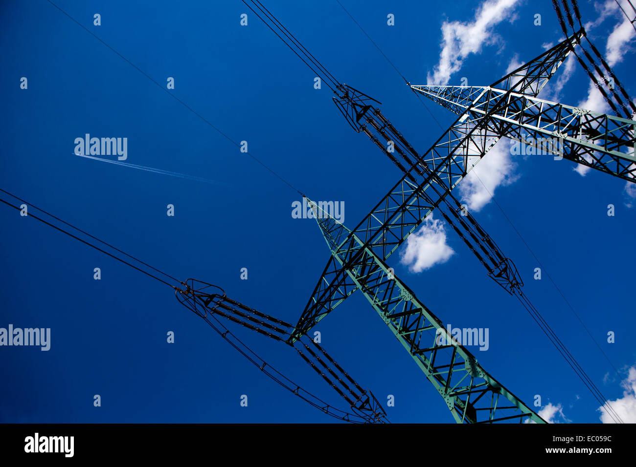Power lines pylon against blue sky Electric mast Czech Republic Stock Photo