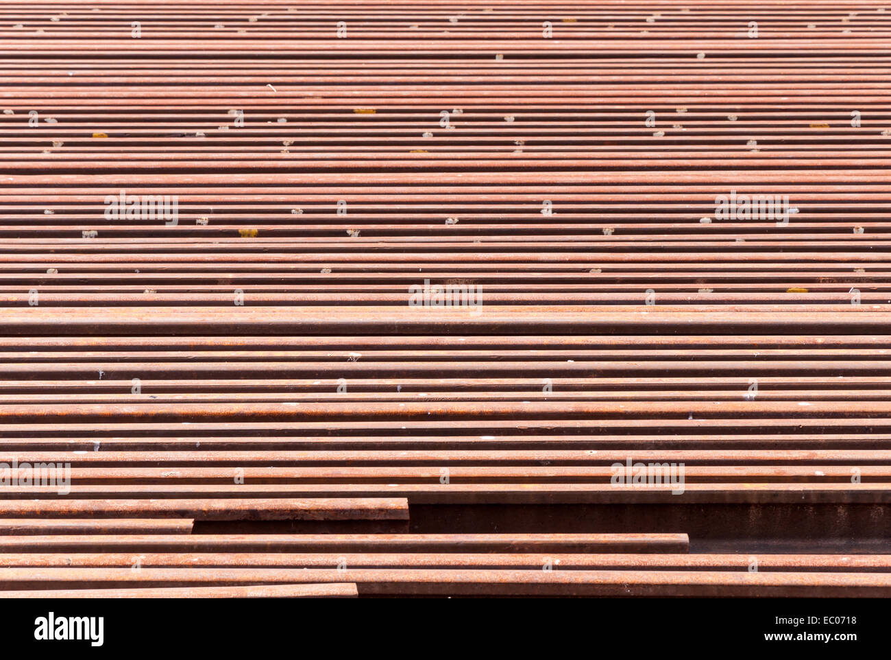 Rusty steel rail beside the track of station Stock Photo - Alamy