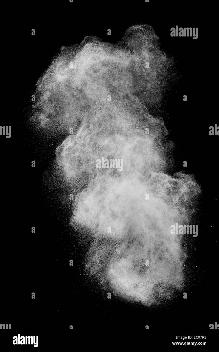 White powder explosion isolated on black background Stock Photo - Alamy