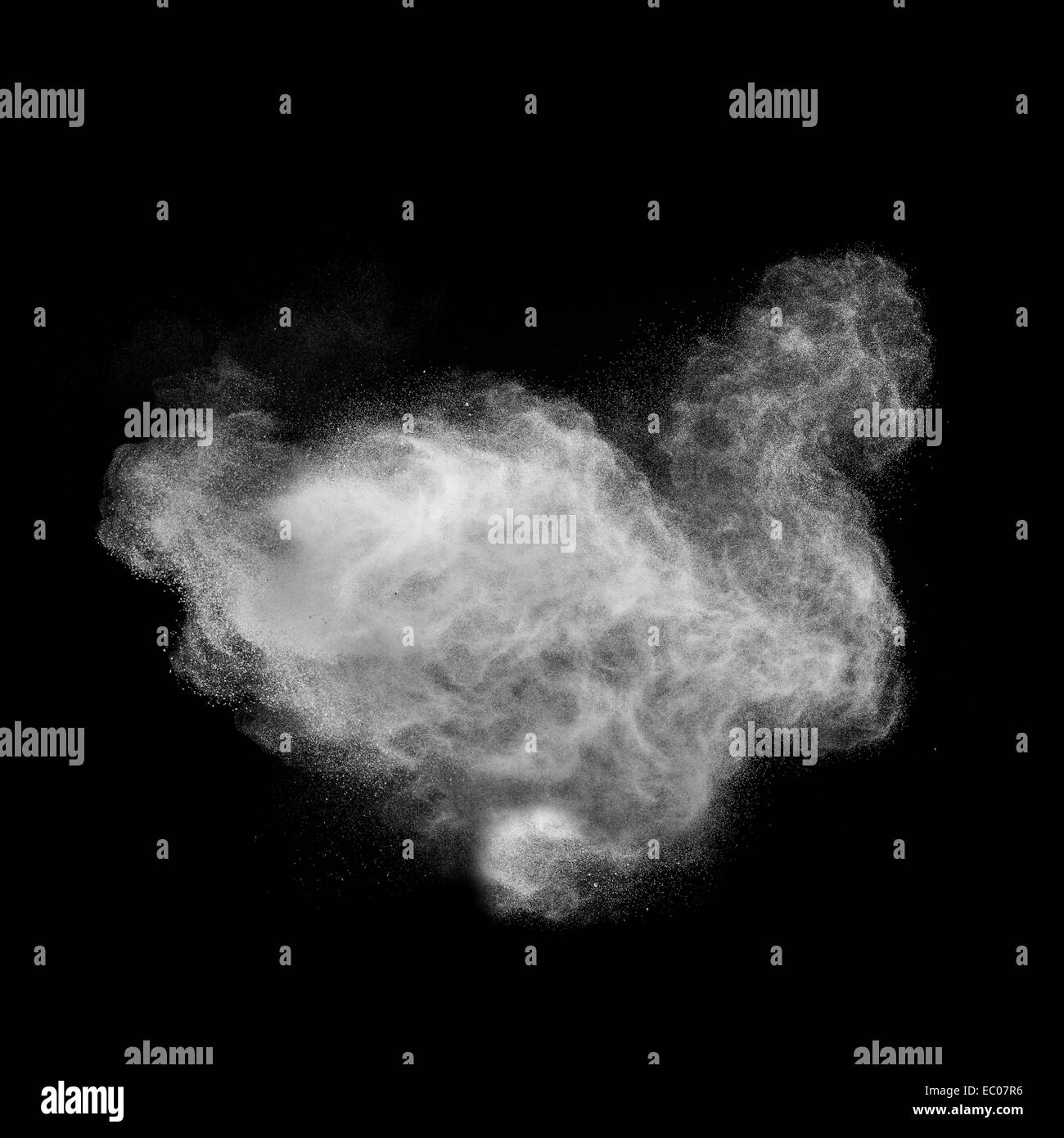 White powder explosion isolated on black background Stock Photo - Alamy