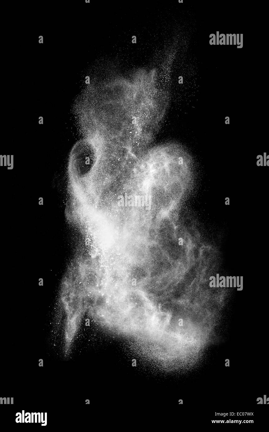 White powder explosion isolated on black background Stock Photo - Alamy