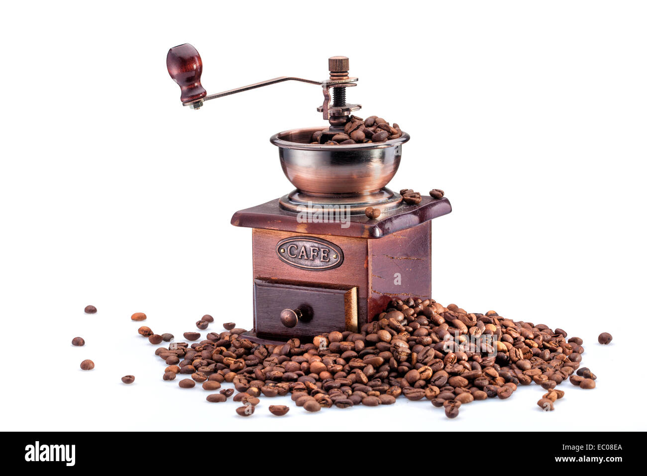 https://c8.alamy.com/comp/EC08EA/retro-manual-coffee-mill-on-roasted-coffee-beans-isolated-EC08EA.jpg