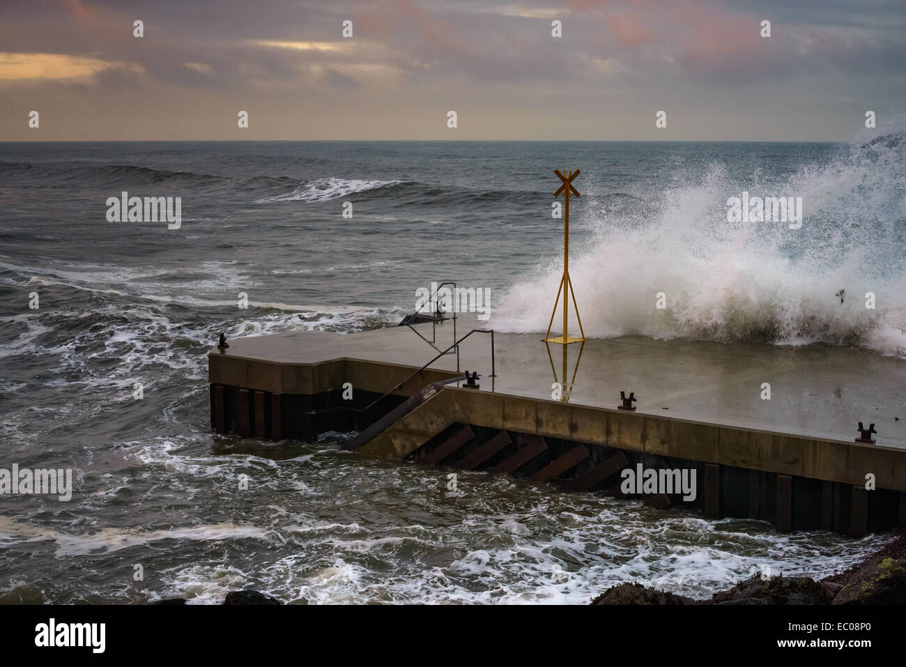 Stormy waves crashing over the pier at North Berwick, East Lothian, Scotland Stock Photo