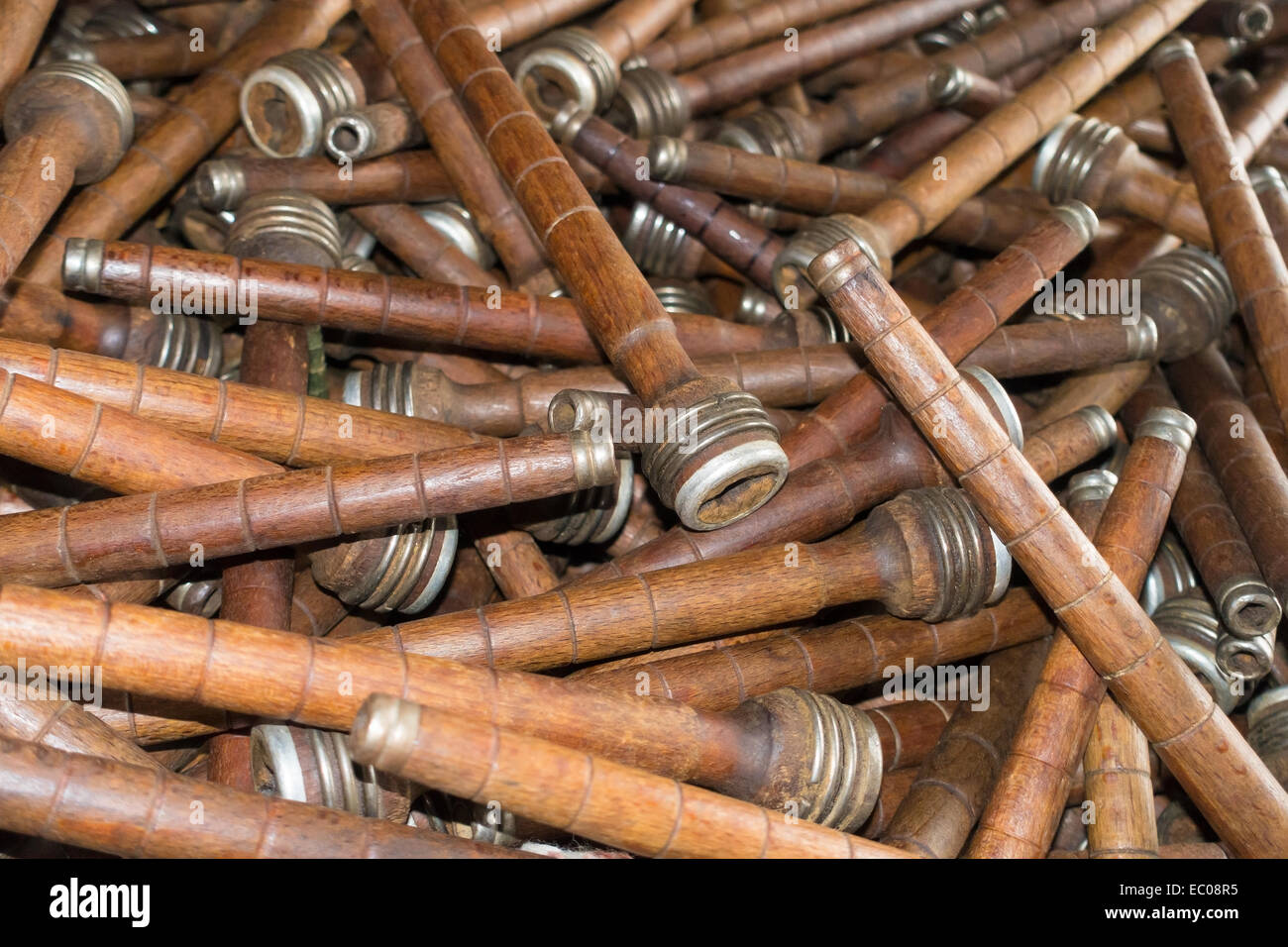 A pile of old wooden bobbins used in a cotton mill in Yorkshire, England. Stock Photo