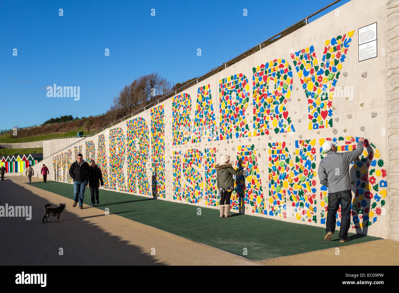 New public climbing wall opened December 2014 at Barry Island with writing in Welsh and English, Wales, UK Stock Photo