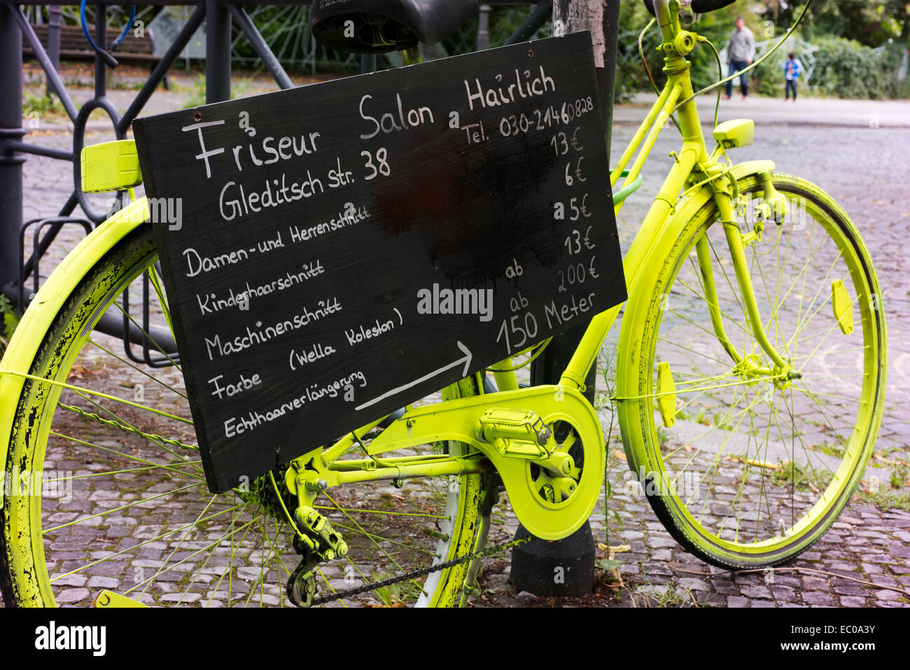 Luminescent paint on a bike used as part of a promotion for a Berlin hairdresser. Stock Photo