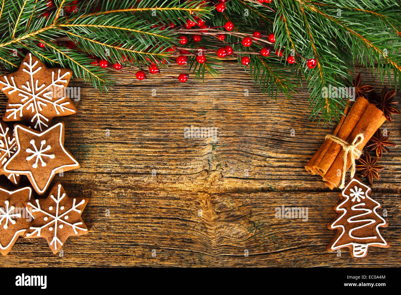 Christmas composition - gingerbread, anise and cinnamon on wooden table Stock Photo