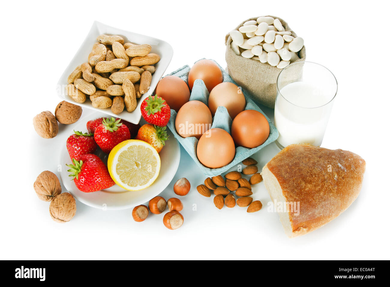 Allergy food concept bread, milk, fruits, nuts, eggs and beans on