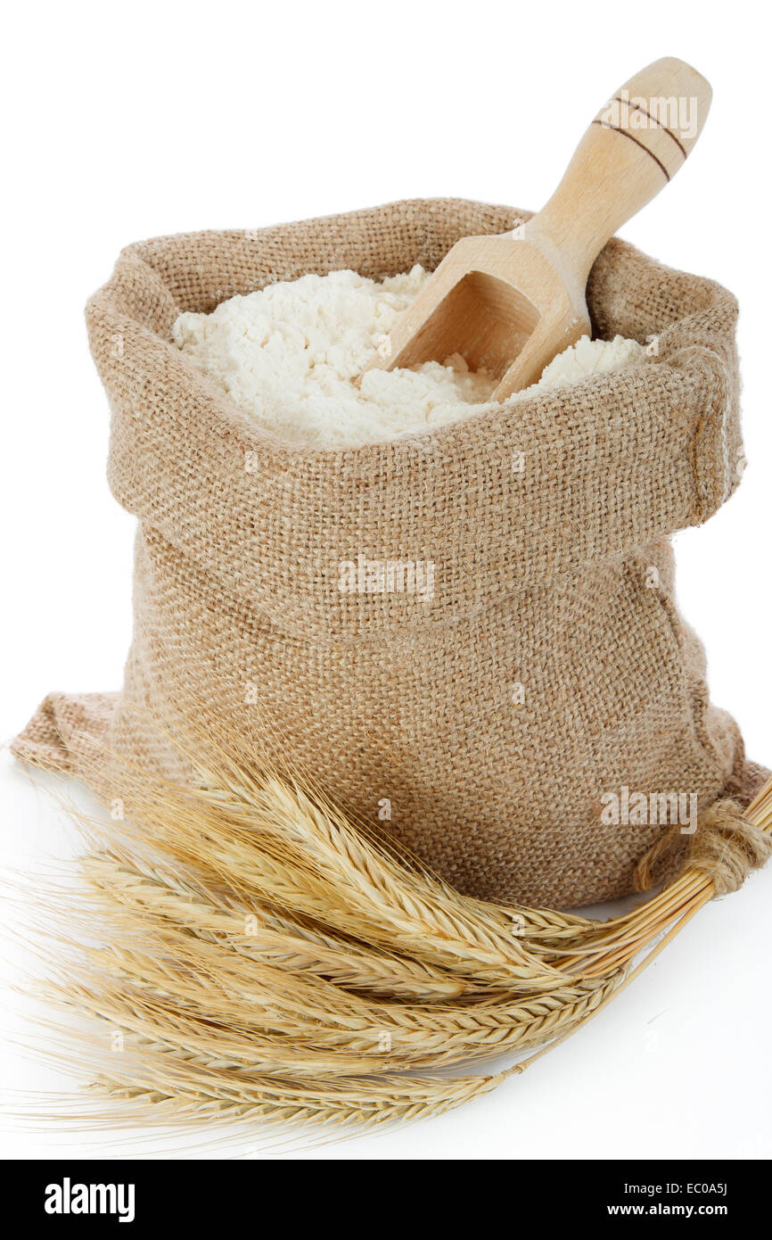 Rye spike and flour in burlap bag Stock Photo
