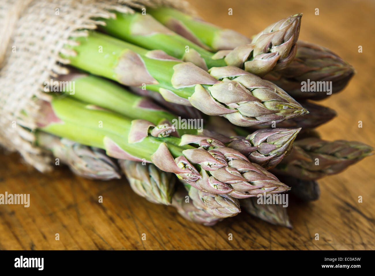 Green asparagus on wooden background Stock Photo