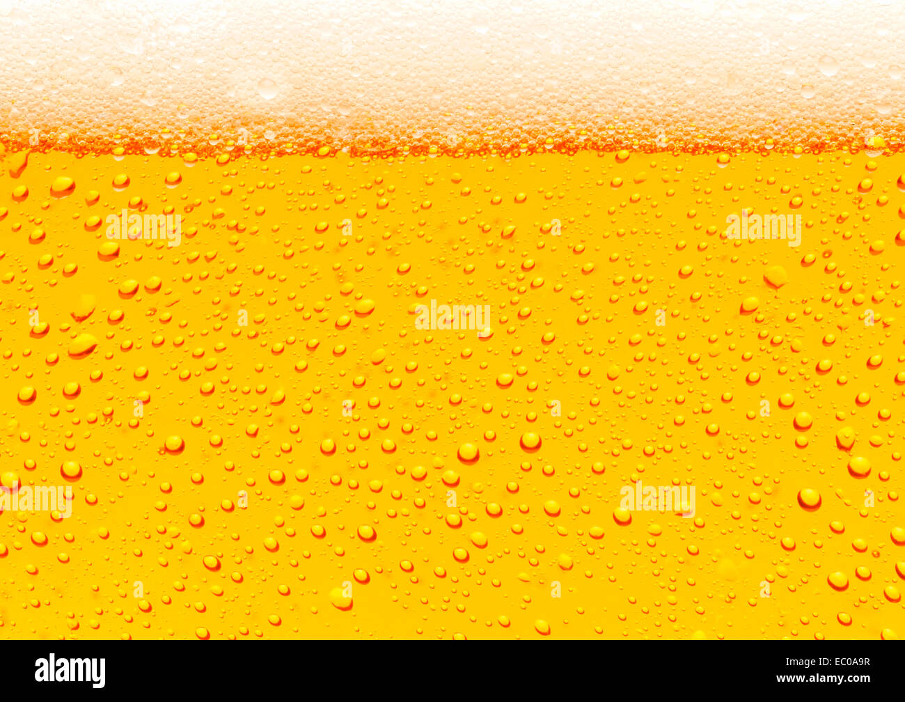 Close up of beer bubbles golden background Stock Photo