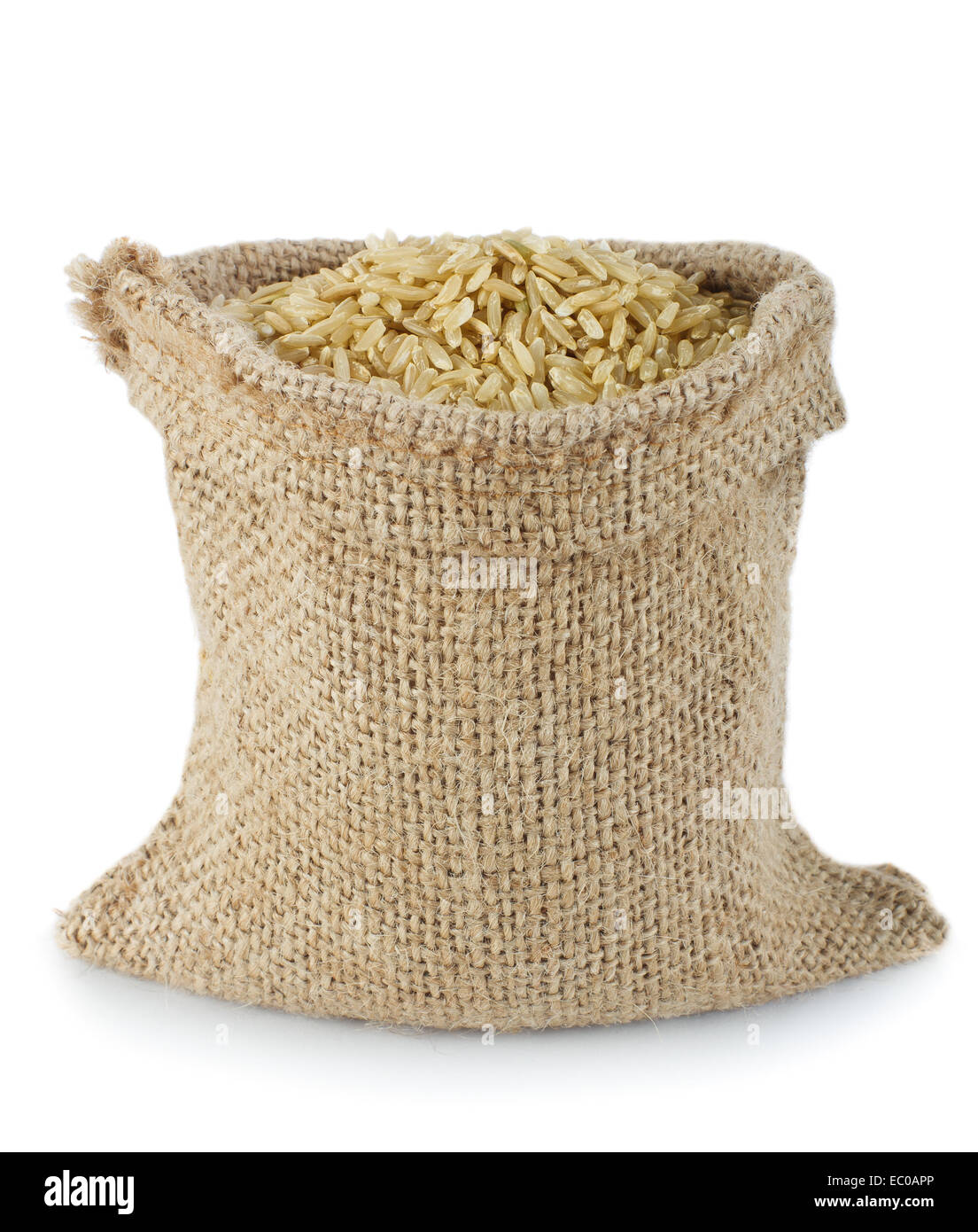 Brown rice in small burlap sack Stock Photo