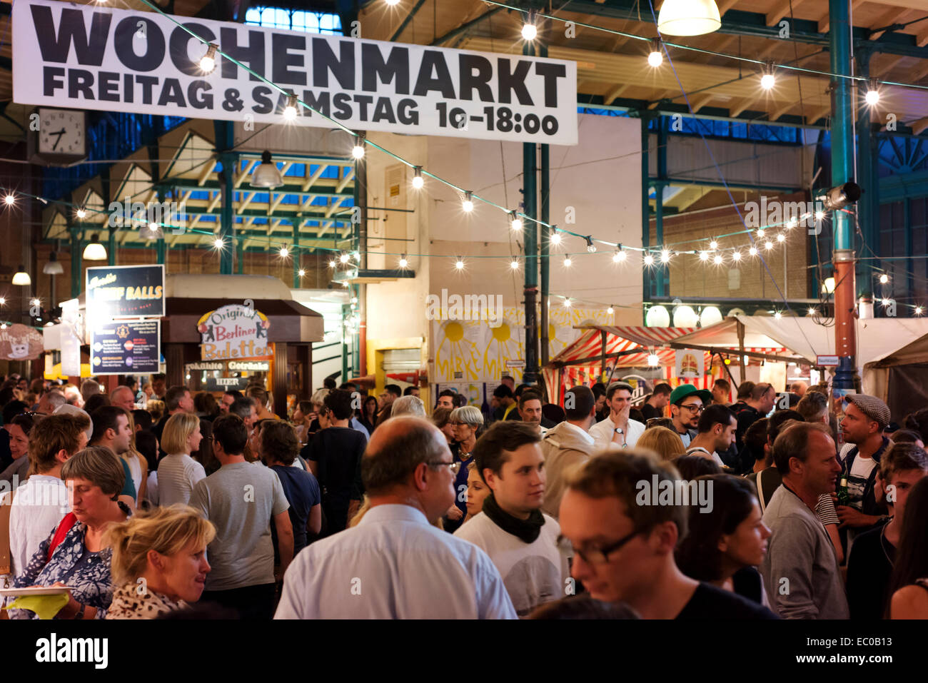 Crowds at Kreuzberg's Markthalle Neun, a place for casual dining and socializing. Stock Photo