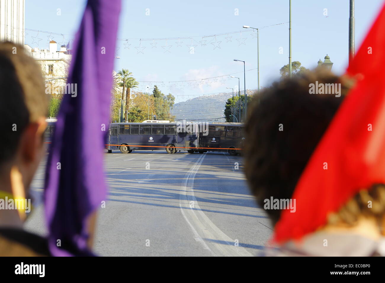 Athens, Greece. 6th Dec, 2014. Protesters watch the riot police buses ...