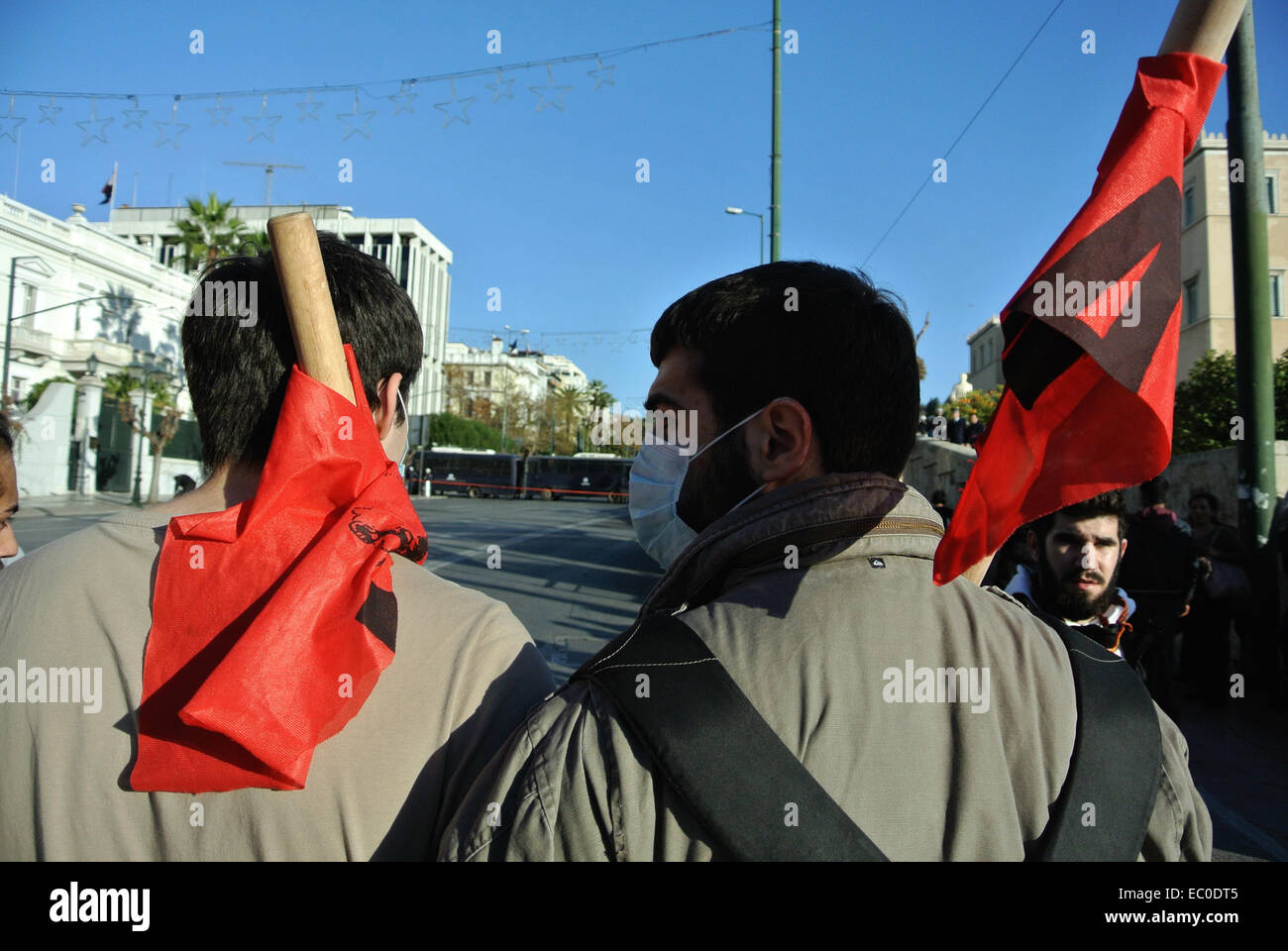 Athens, Greece. 6th Dec, 2014. Demonstrators with red flags face the ...