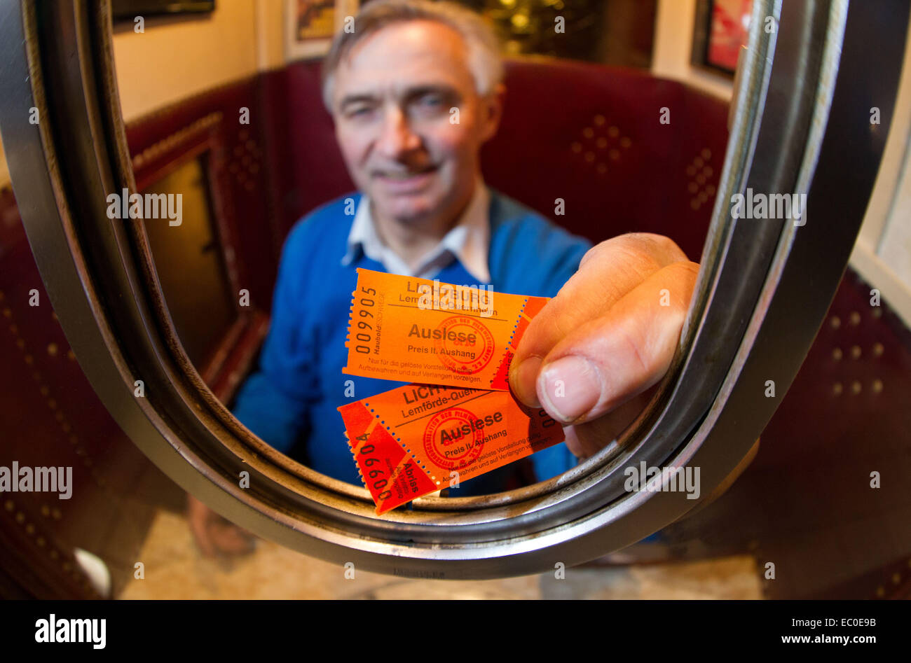 Quernheim, Germany. 28th Nov, 2014. Cinema operator Karl-Heinz Meier sits in his cinema in Quernheim, Germany, 28 November 2014. Meier operates the Lichtburg Kino, the smallest cinema in Germany, according to his report. Photo: FRISO GENTSCH/dpa/Alamy Live News Stock Photo