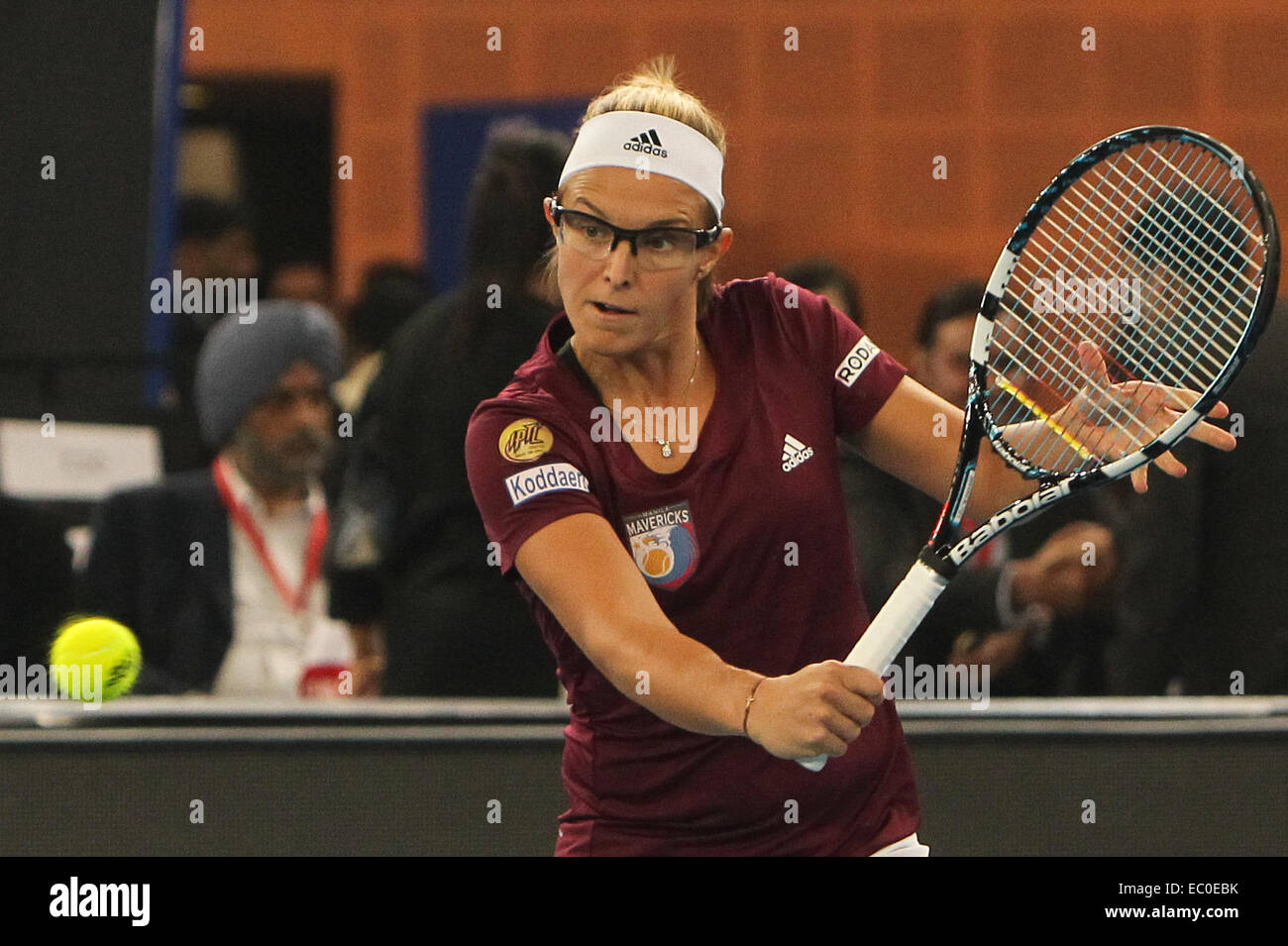 New Delhi, India. 6th Dec, 2014. Kirsten Flipkens of Manila Mavericks hits a return during the match against Indian Aces at the Indian Leg of the International Premier Tennis League in New Delhi, capital of India, Dec. 6, 2014. Indian Aces won by 26-25. © Zheng Huansong/Xinhua/Alamy Live News Stock Photo