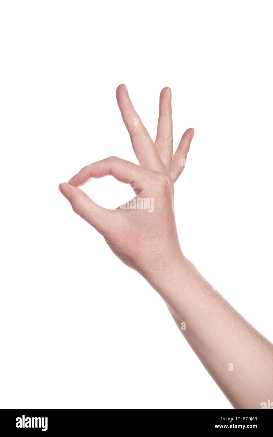Caucasian white female hand making OK sign isolated on a white isolated background Stock Photo