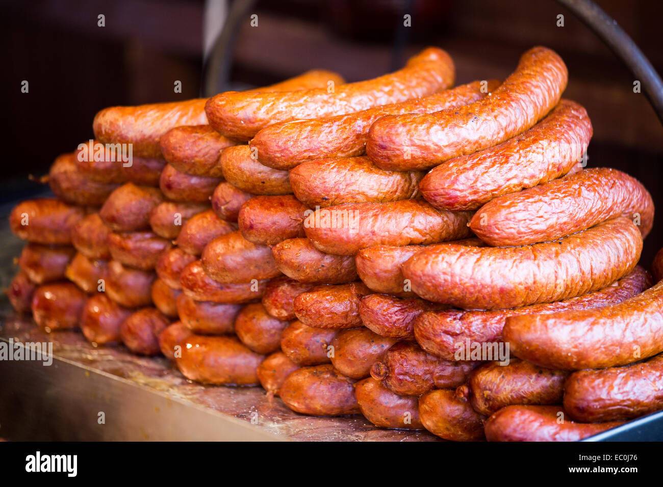 Premium Vector  Assorted krakow sausages on wooden plate