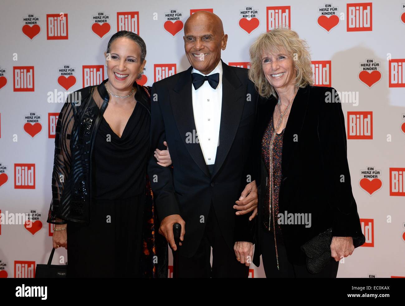 Berlin, Germany. 6th Dec, 2014. Singer Harry Belafonte arrives with his wife Pamela (R) and his daughter Gina arrive to the charity gala 'Ein Herz fuer Kinder' (lit. 'A heart for children') in Berlin, Germany, 6 December 2014. The gala will be aired live on TV broadcaster ZDF. Photo: Joerg Carstensen/dpa/Alamy Live News Stock Photo