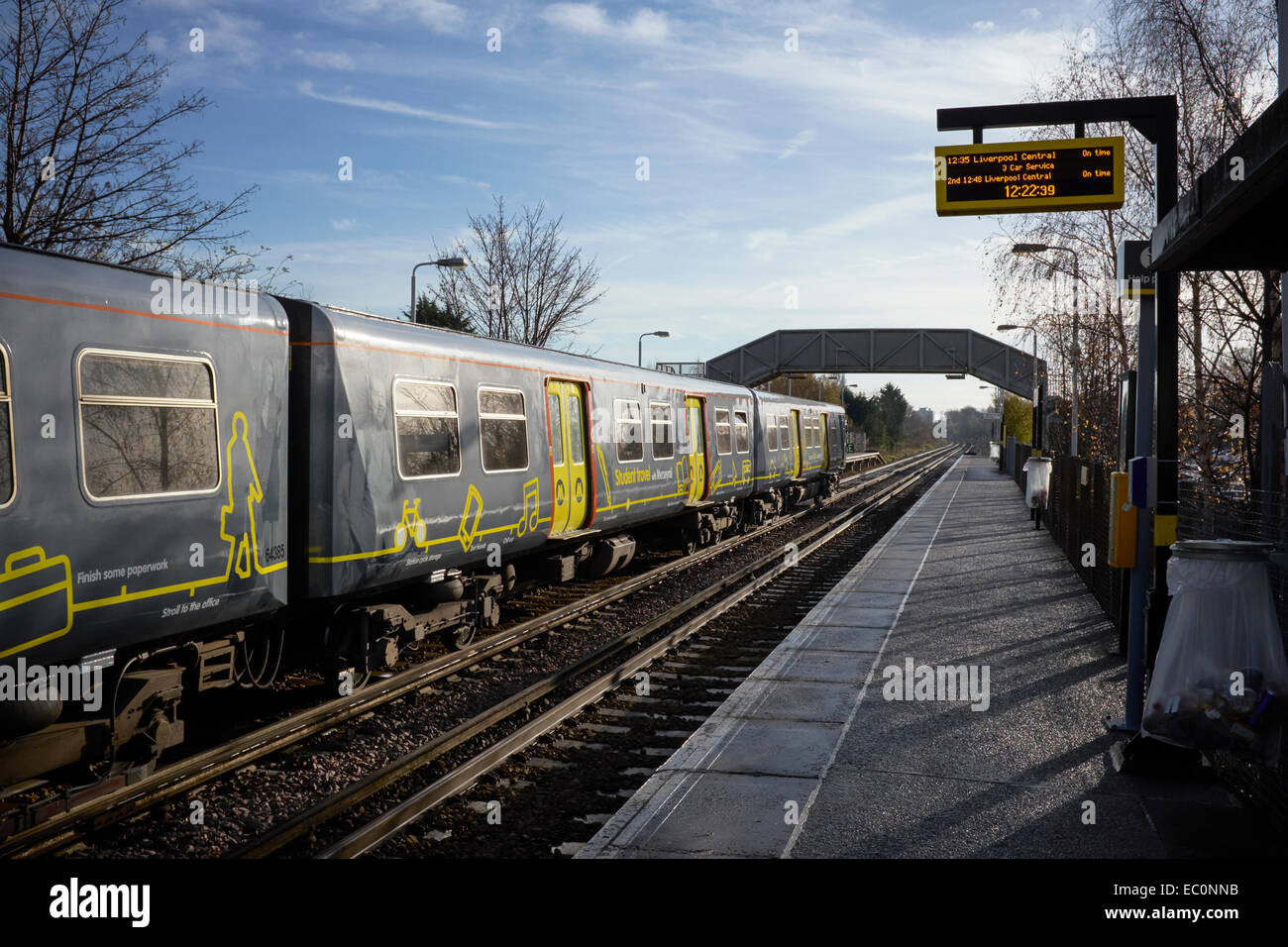 A Wirral Line Merseyrail train at Bache Station travelling from Liverpool to Chester Stock Photo