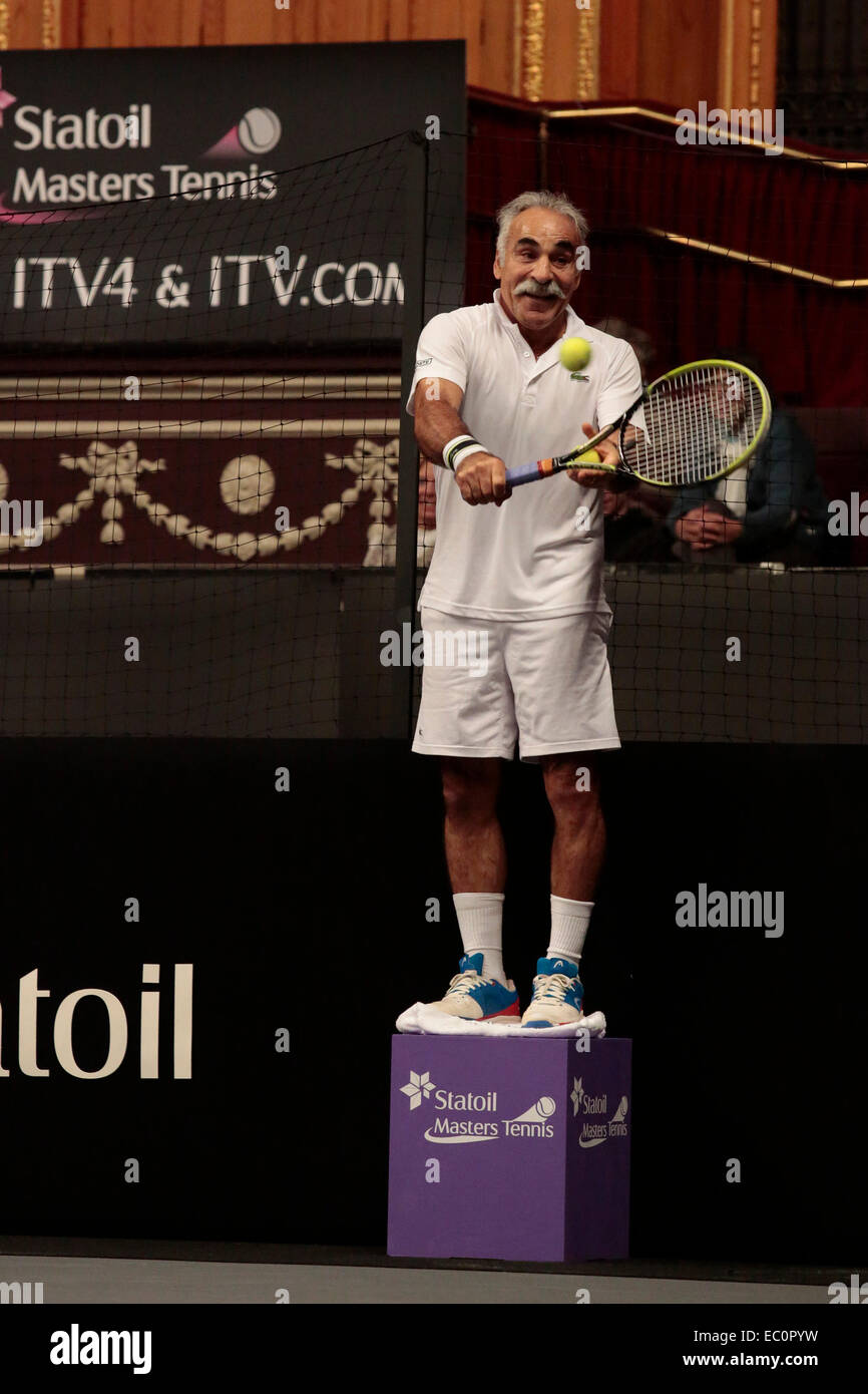 London, UK. 7 December 2014. Mansour Bahrani uses a vantage point to play  from. ATP Champions Tour final of the Statoil Masters Tennis tournament at  the Royal Albert Hall, London. Men's double