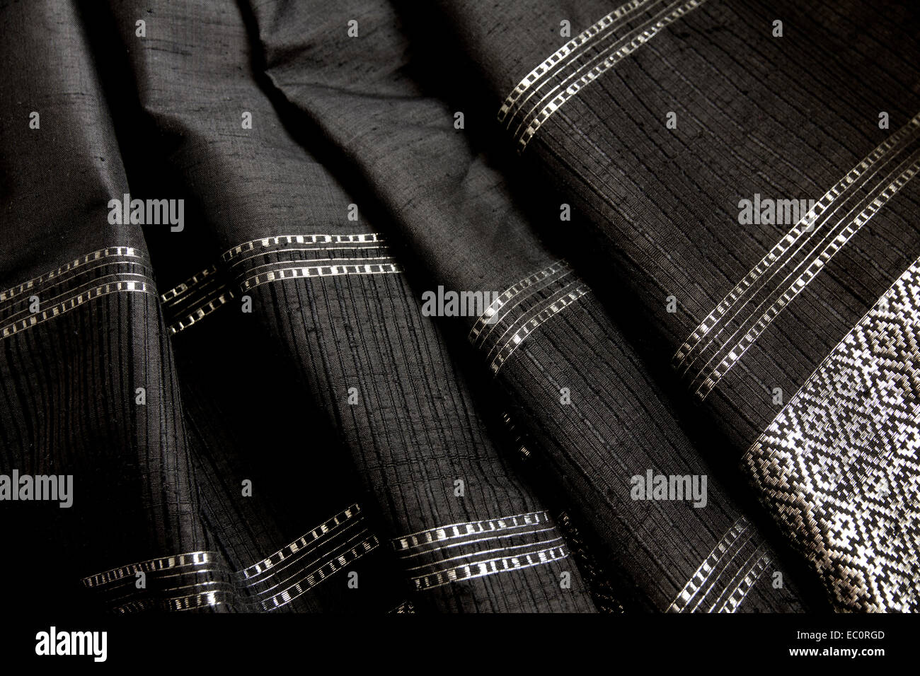 Thai Slub Silk black and silver pattern design loosely folded Stock Photo