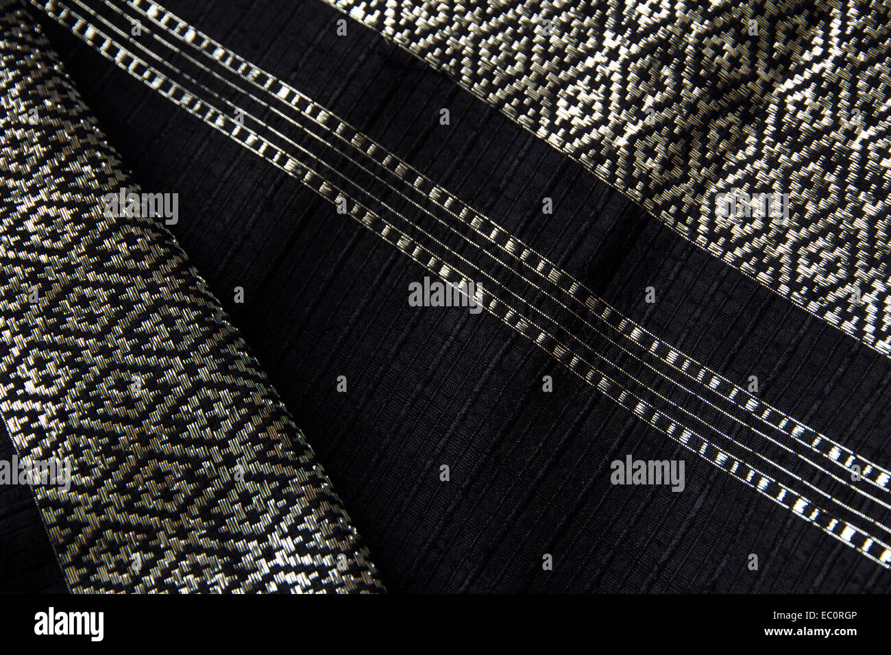 Thai Slub Silk, Black and silver woven in the pattern. Stock Photo
