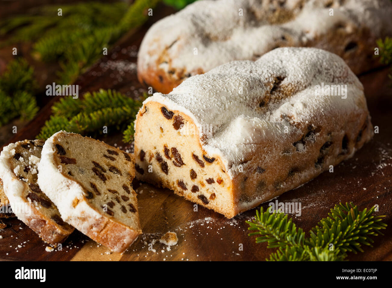 Festive Christmas German Stollen Bread with Powdered Sugar Stock Photo