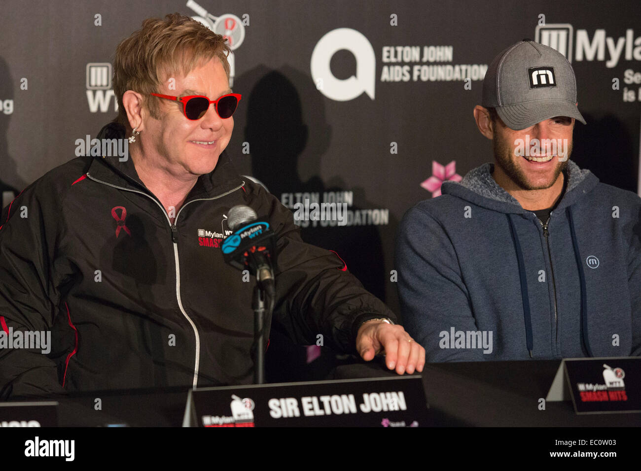 London, UK. 7 December 2014. Sir Elton John and Andy Roddick. Press conference led by Billie Jean King and Sir Elton John ahead of the tennis matches of the 22nd Mylan World Team Tennis Smash Hits at the Royal Albert Hall, London. Event participants include Andy Roddick, Tim Henman, Kim Clijsters, Sabine Lisicki, John McEnroe, Jamie Murray, Heather Watson and Martina Hingis. The event raises money for the Elton John Aids Foundation (EJAF). The event takes place during Statoil Masters Tennis. Credit:  Nick Savage/Alamy Live News Stock Photo