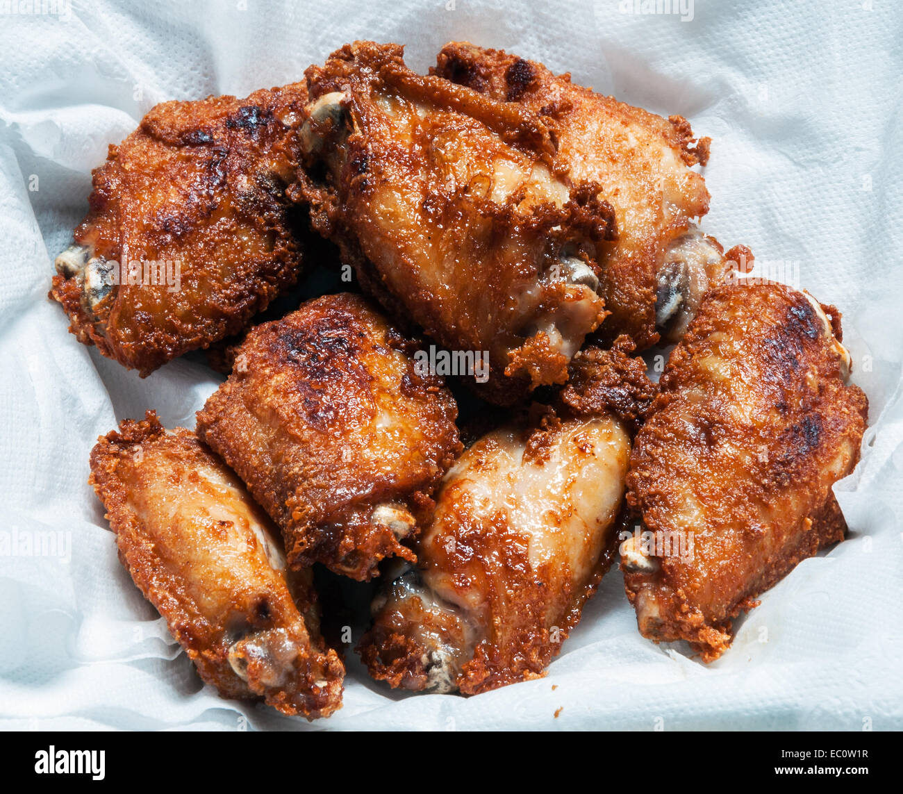 Crispy fired chicken on the white tissues. Stock Photo